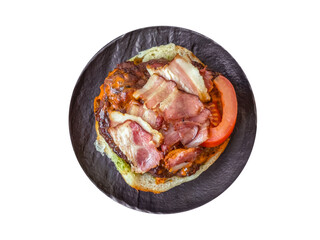 Juicy burger with beef patty, tomatoes, cheese, bacon, salt and spices