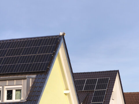 Renovated residential buildings with solar panels on the roofs