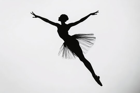 Black silhouette of a ballerina in mid-pirouette on a white background.