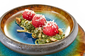 Pasta with spinach and beet puree balls. Healthy dish, organic food, White background.