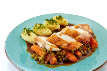Chicken breast sous vide on roasted carrots and peas, mashed potatoes and gravy. Healthy dish, organic food, White background.