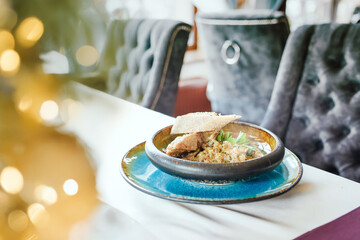 A dish of mushrooms, vegetables and meat, with grilled bread. Healthy dish, organic food.