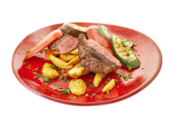Steak medium rar, grilled peppers, potatoes, vegetables Italian cuisine, keto diet, Italian recipes, restaurant food. White background.
