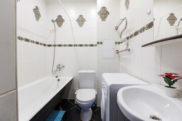 modern bathroom room with toilet and washing machine