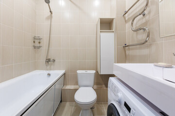 modern bathroom room with toilet and washing machine