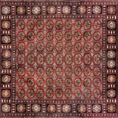 Close up of classic middle eastern Arabic and morroccan carpet rug texture. Seen here the random...