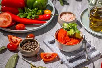 Pickled peppers with fresh ingredients and spices creating a vibrant culinary scene