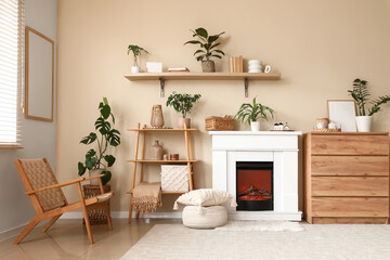 Interior of living room with fireplace, shelving unit and wicker chair near beige wall