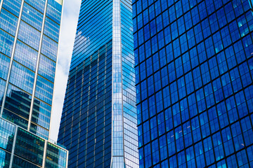 Fototapeta premium Skyscraper futuristic structures. Modern city perspective. Skyscraper in metropolis city. City downtown with skyscraper in perspective. Perspective view. Skyscraper building architecture