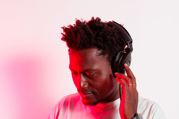 Portrait of black person enjoying music with headphones on