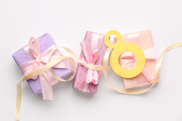 Paper figure 8 with gift boxes on white background. Happy Women's Day