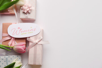 Festive postcard with gift boxes and tulips on white background. Happy Women's Day
