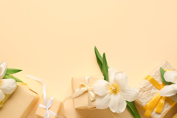 Gift boxes with flowers on beige background. Happy Women's Day