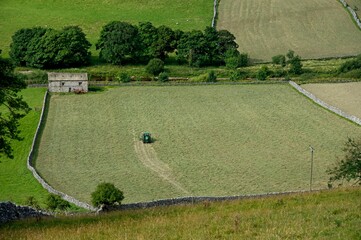 Obraz premium Tractor working in the field