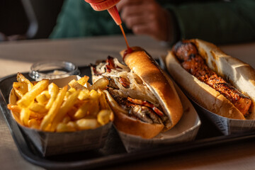 Savory Spanish Pork Sandwiches Freshly Served with Fries and Sauce
