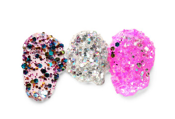 Smears of different glitters on white background