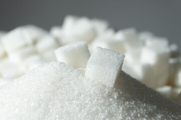 White refined beet sugar in the form of crystals and cubes.