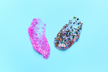 Glitter strokes on blue background, closeup