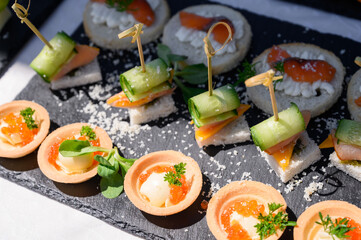 Buffet table. Snacks for the banquet. Meat and fruit plates