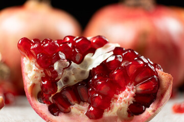 Close-up of pomegranate seeds, an open fruit, the benefits of pomegranates.