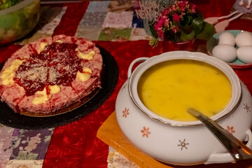 Delicious homemade soup and dessert prepared for a family gathering at home during the evening