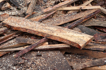 Pile of discarded broken boards at a sawmill. Selective focus