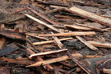 Broken planks. Pile of broken boards at the sawmill. Selective focus
