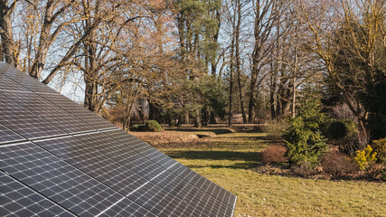 Positioning of solar energy panels in the garden landscape, nature, backyard area. Independent energy.