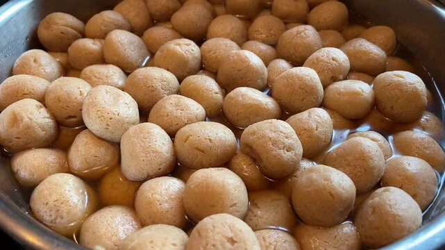 Bowl full of freshly prepared Rosogolla in display.