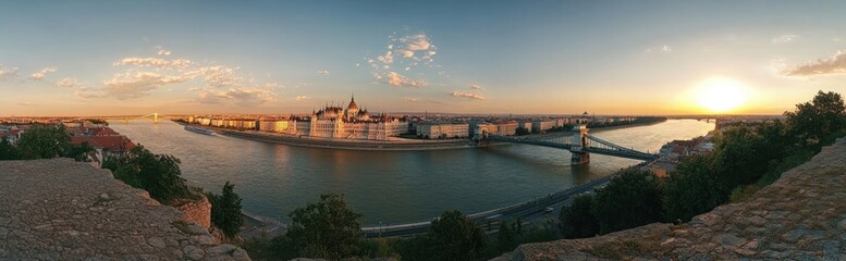 Fototapeta premium Panoramic view of Budapest with the river and bridges, panoramic panorama of cityscape of Hungary at sunset, front or top view of beautiful old European city, traditional architecture buildings