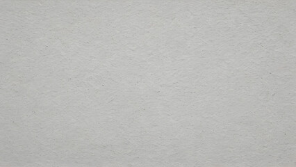 Rough textured white concrete wall providing a blank background