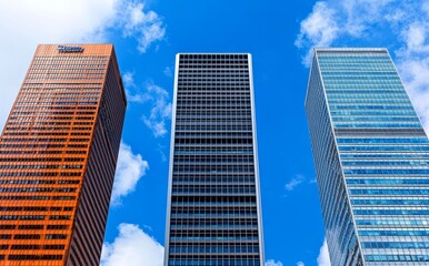 Obraz premium A low, wide-angle view of modern glass and steel skyscrapers in London Docklands.