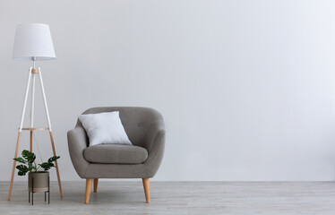 Modern minimal interior of home office, living room or bedroom. Gray vintage armchair with white...