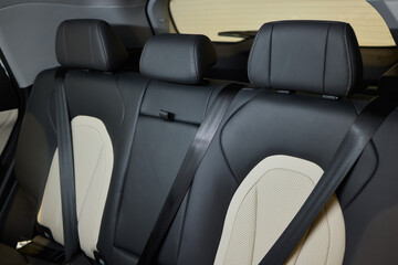 Obraz premium Car back seat with headrest and arm rest, a comfortable automotive fixture