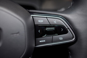 Naklejka premium The modern cars steering wheel control panel boosts convenience and performance