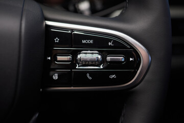 The modern cars steering wheel control panel boosts convenience and performance