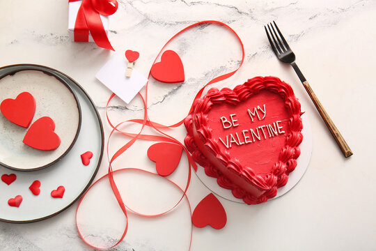 Sweet bento cake with gift box and hearts on white background. Valentine's Day celebration
