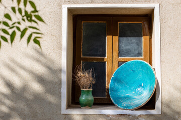 old persian window with ceramic decor pottery on the window frame middle eastern design historic 
