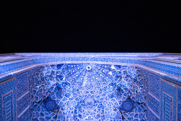 The Jāmeh aka jame Mosque of Yazd beautiful persian architecture with mosaic tile work ceramic geometric shapes minarets islamic architecture at night 