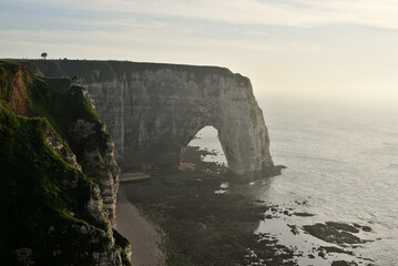 White cliffs in Normandy, France in Etretat at sunset