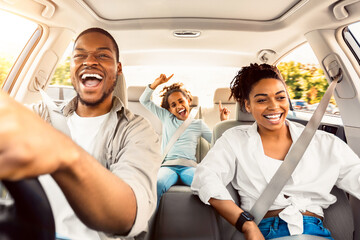 Summer Road Trip. Happy Black Family Of Three Riding Car And Singing Having Fun Traveling By...