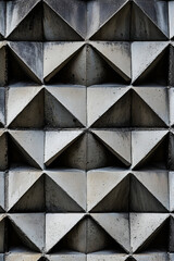 Obraz premium Geometric Harmony: Interlocked Triangles in a Symphonic Repetition