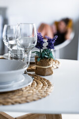 Elegant dining setup with floral decoration in a modern kitchen space