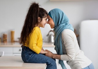 Mother's Day Concept. Adorable Little Girl Bonding With Her Muslim Mom In Hijab At Home, Happy...