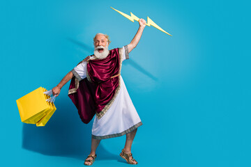 Photo of crazy man wear costume powerful mythological god isolated on blue color background