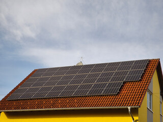 Solar panels on the roof of an energy-renovated residential building