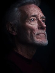 Pensive Elderly Man, Dark Background, Close-Up Portrait