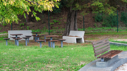 Picnic area with wooden tables and benches in a park