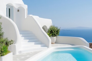 Obraz premium White house with a pool and steps leading up to it