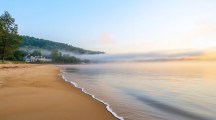 Fototapeta premium Tranquil Sunrise on Misty Beach: Serenity and Peace by the Coastline